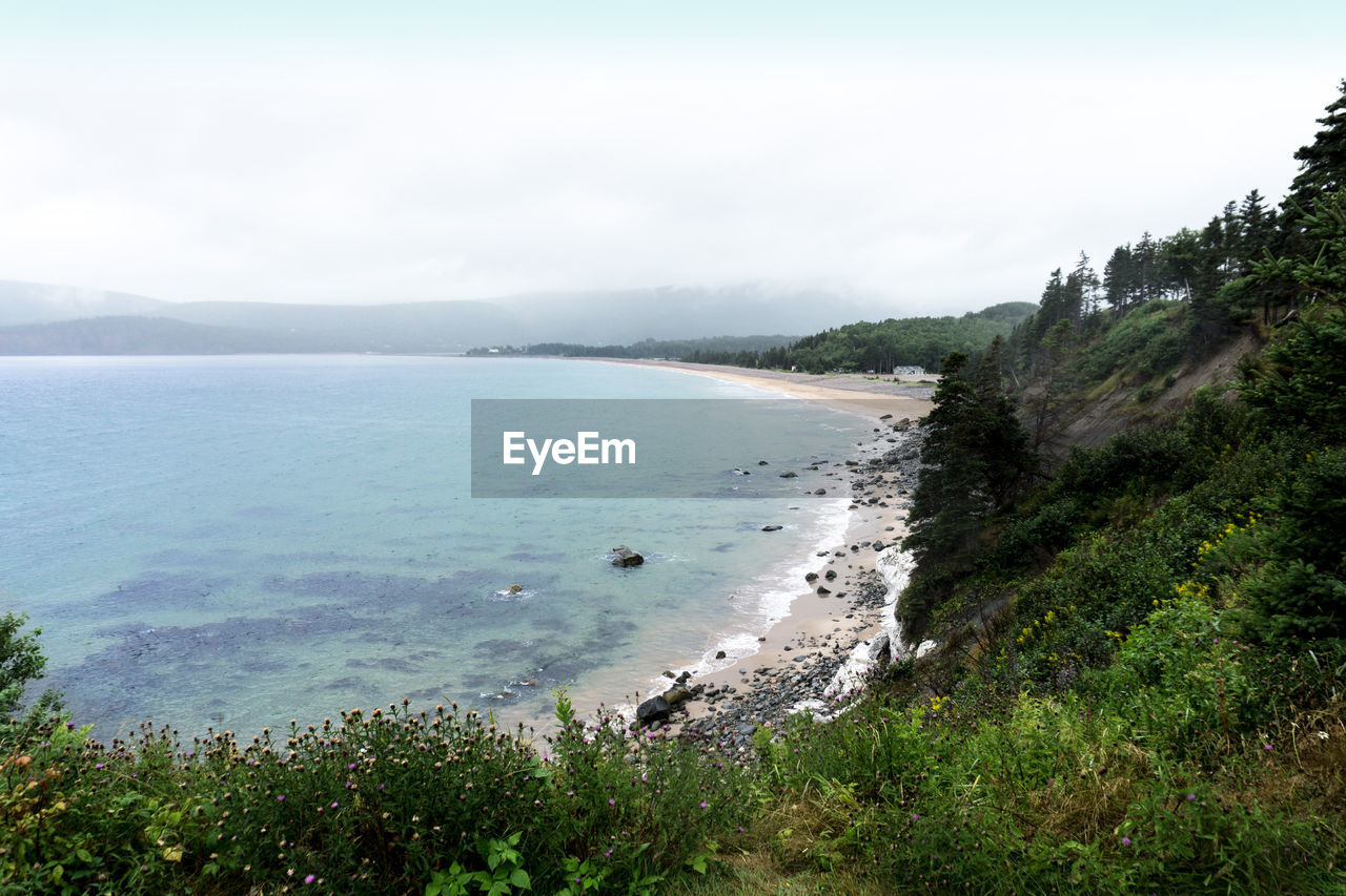 High angle view of bay against sky