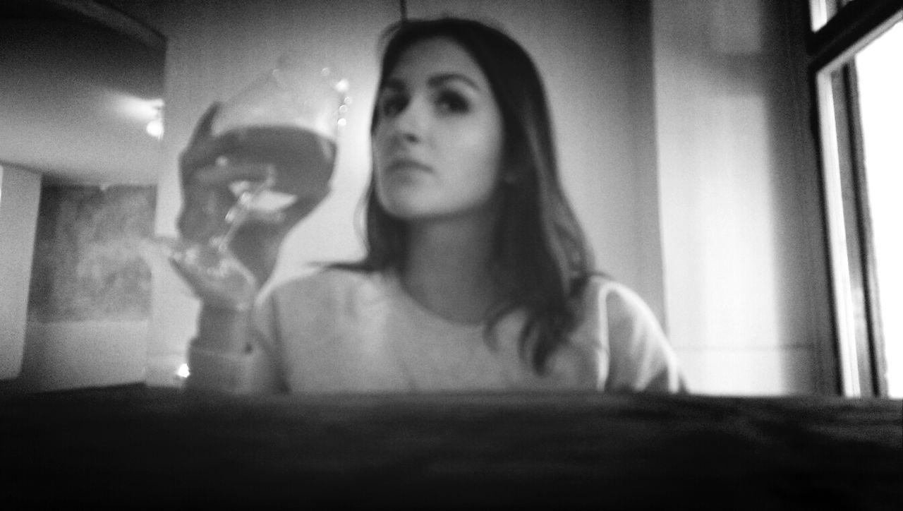 Young woman drinking wine