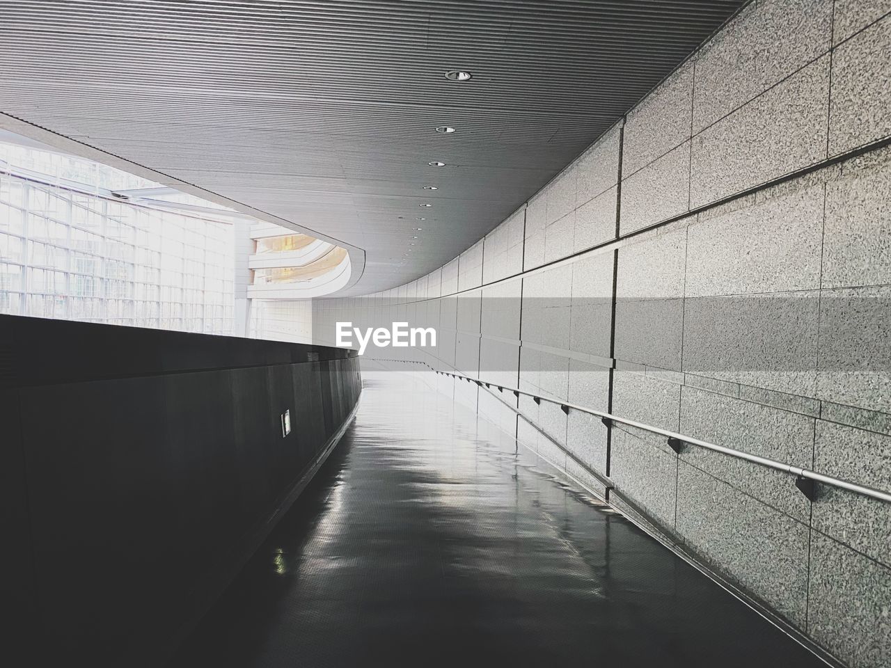subway, architecture, light, line, indoors, built structure, white, wall - building feature, no people, wall, ceiling, flooring, corridor, black, the way forward, arcade, diminishing perspective, tunnel, monochrome, floor, hall, transportation, building, infrastructure, absence, day