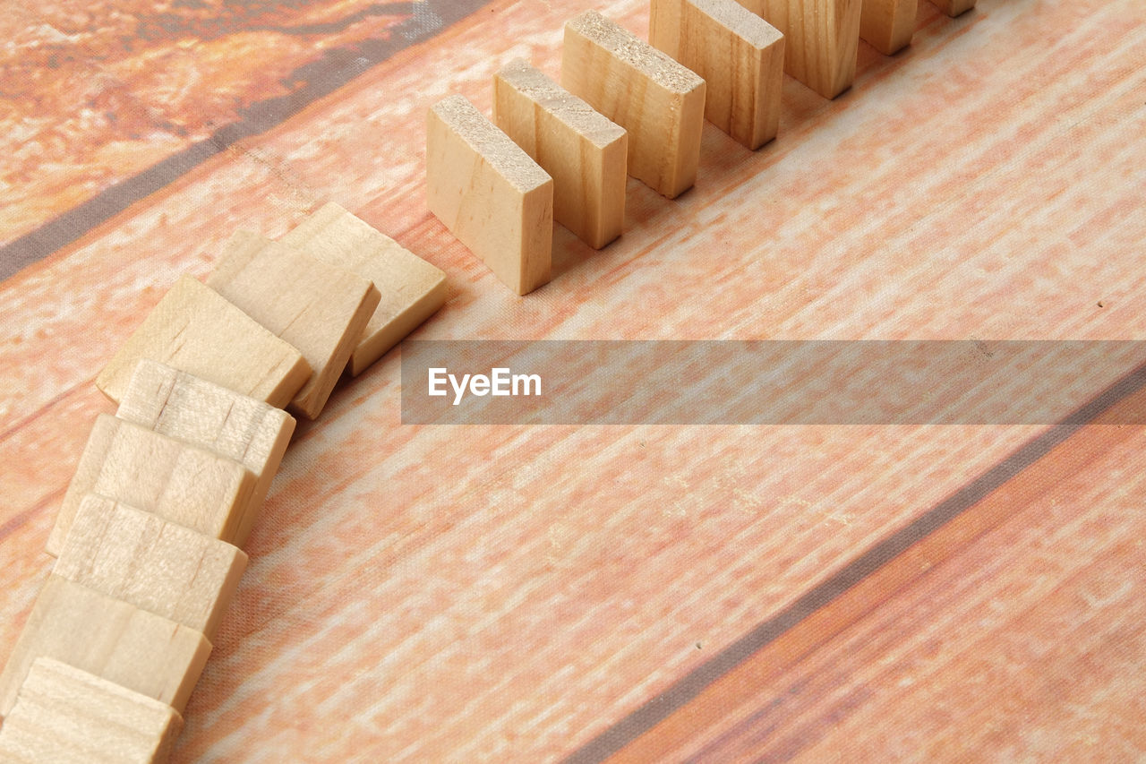 High angle view of toy blocks arranged on wooden table