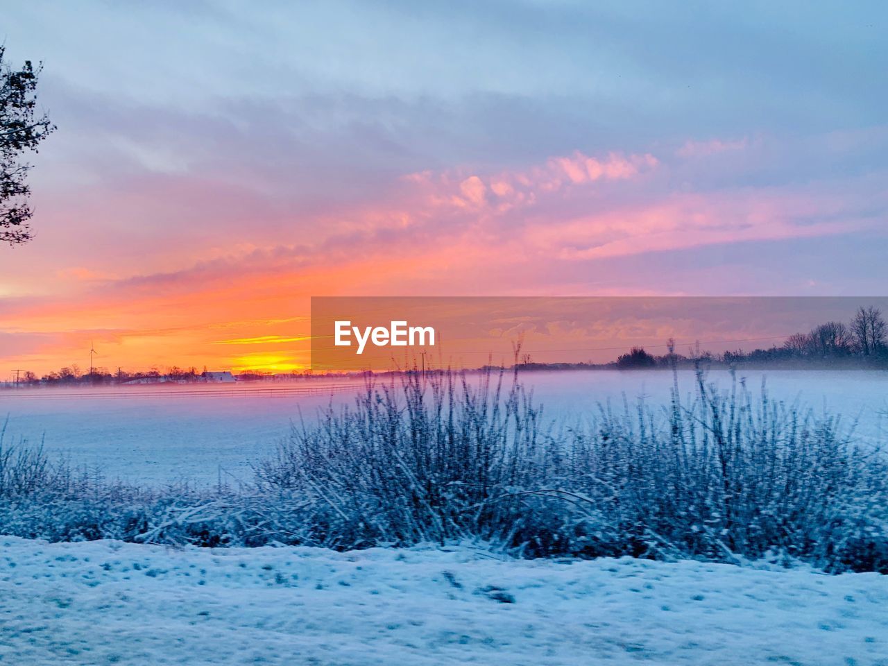 SCENIC VIEW OF SNOW DURING SUNSET AGAINST SKY