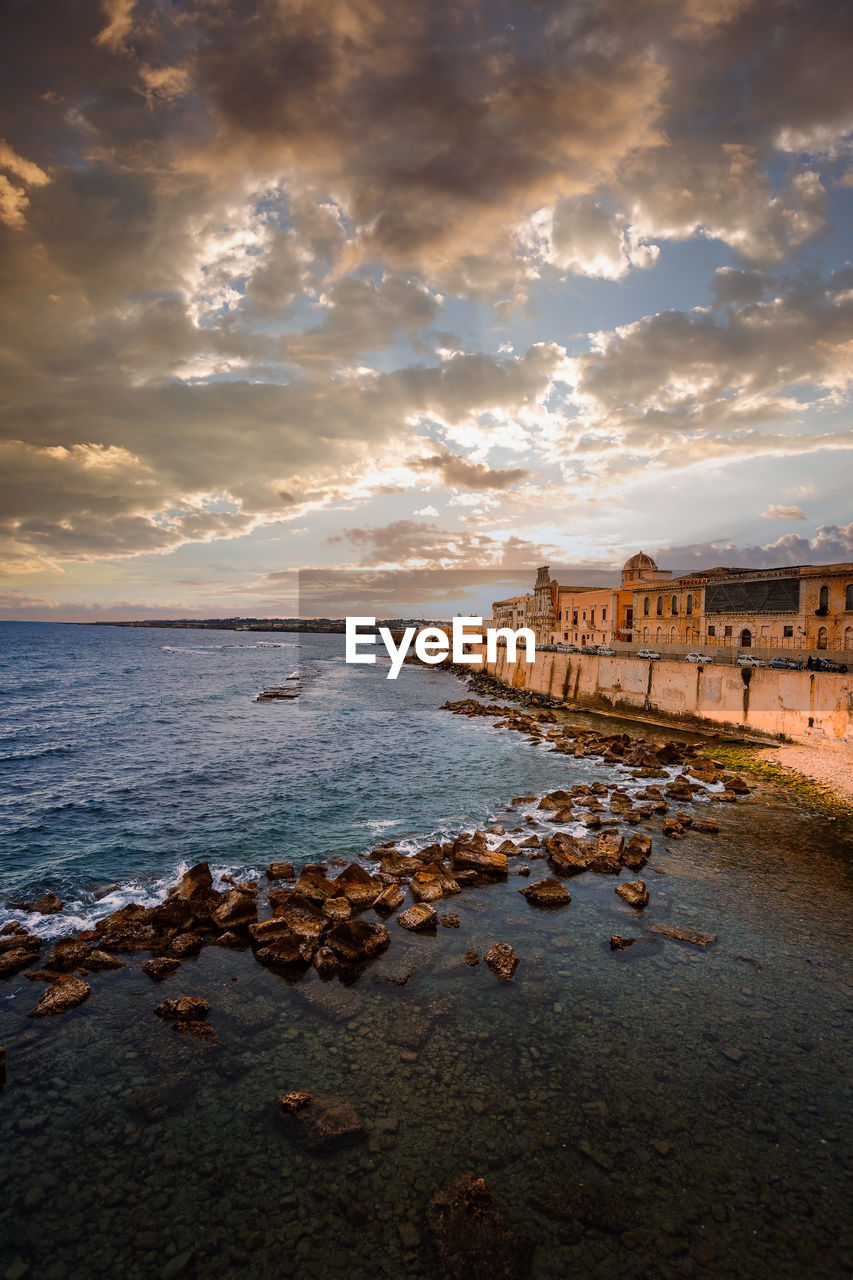 Spectacular sunset over the sea with maniace castle