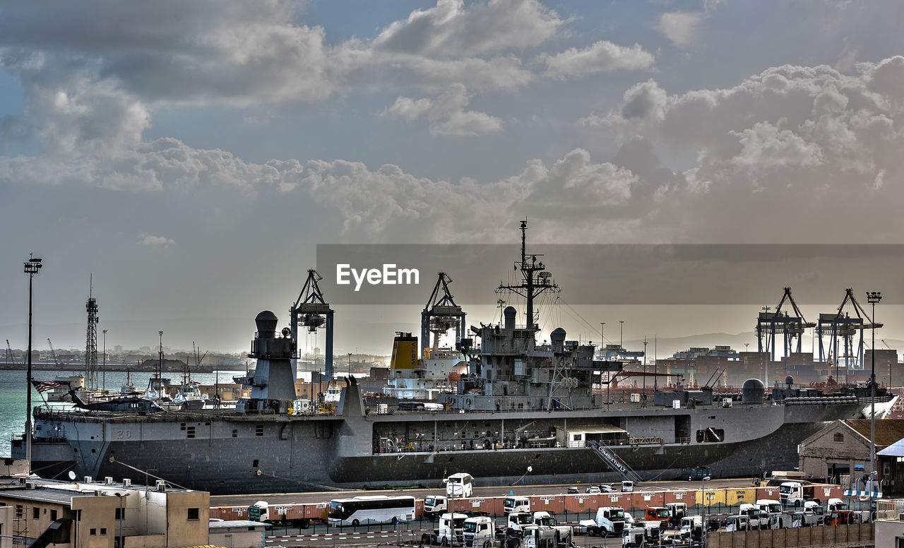 VIEW OF COMMERCIAL DOCK AGAINST SKY