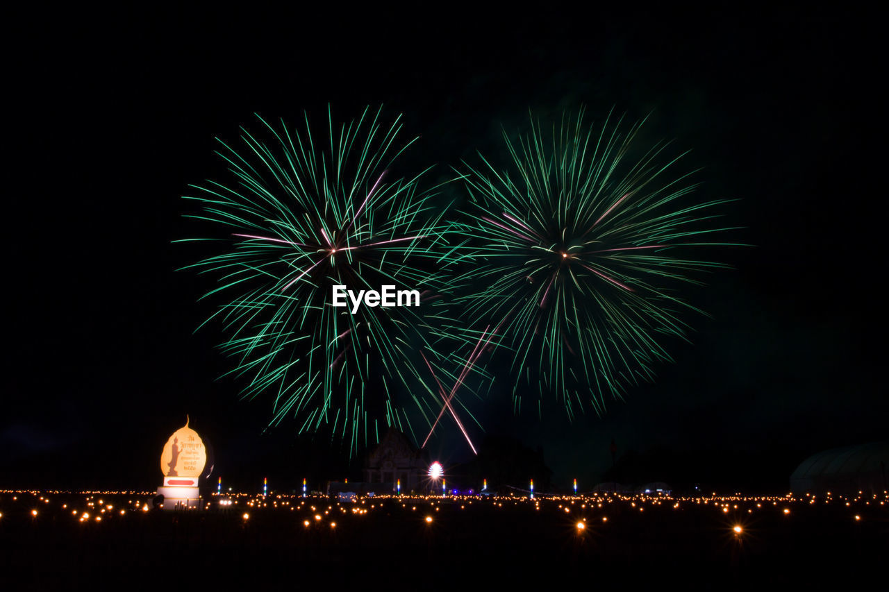 Firework display at night