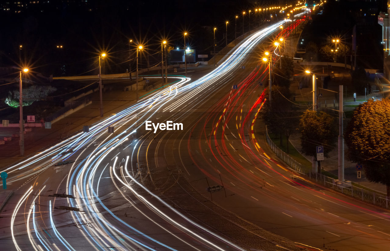 High angle view of light trails on road at night