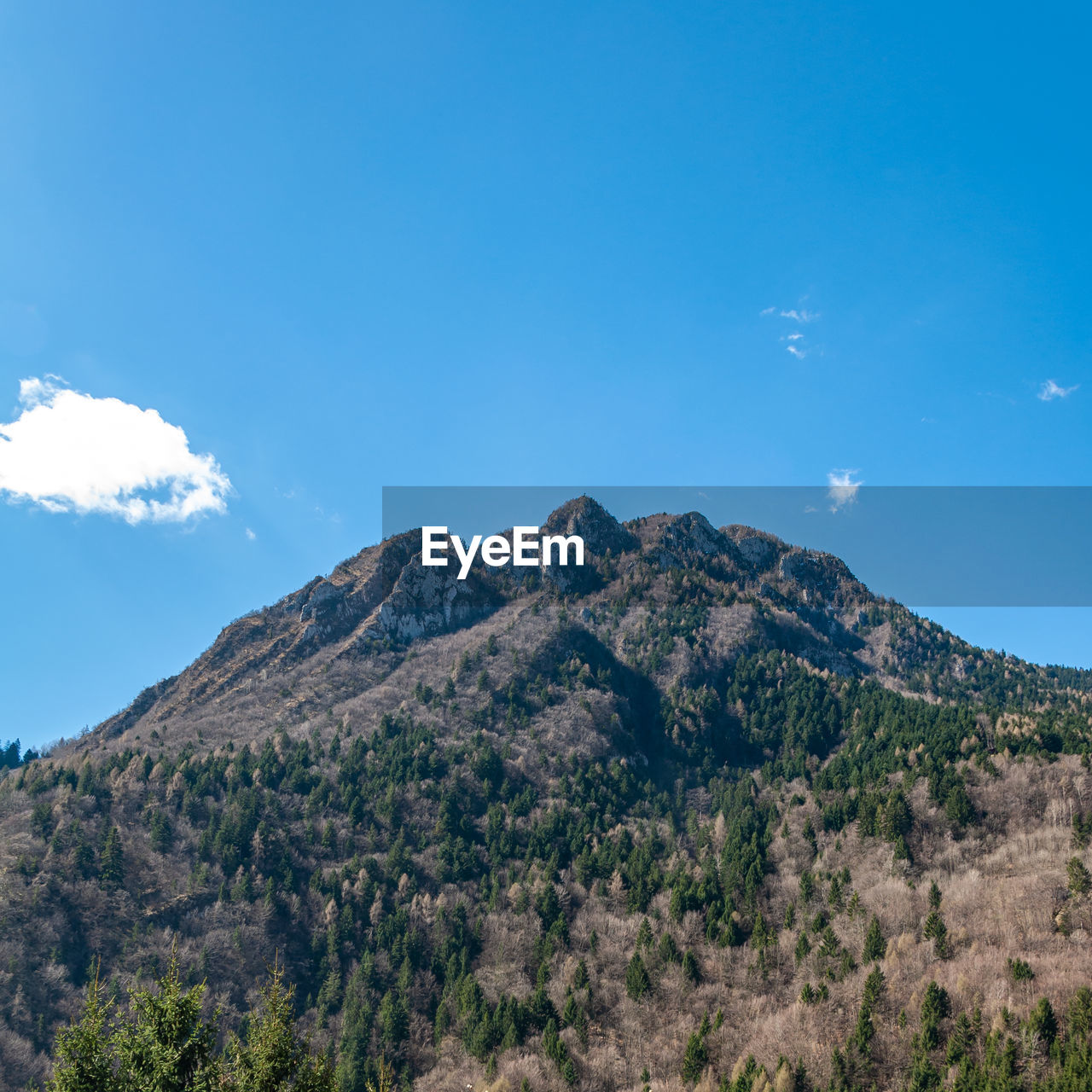 SCENIC VIEW OF MOUNTAINS AGAINST BLUE SKY