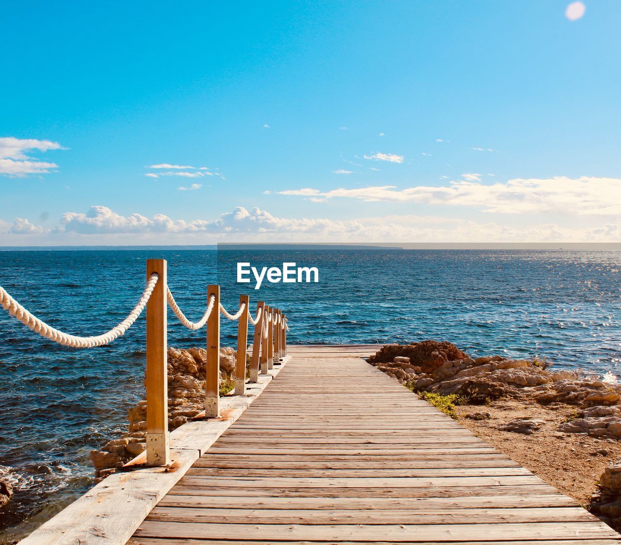 Pier over sea against sky