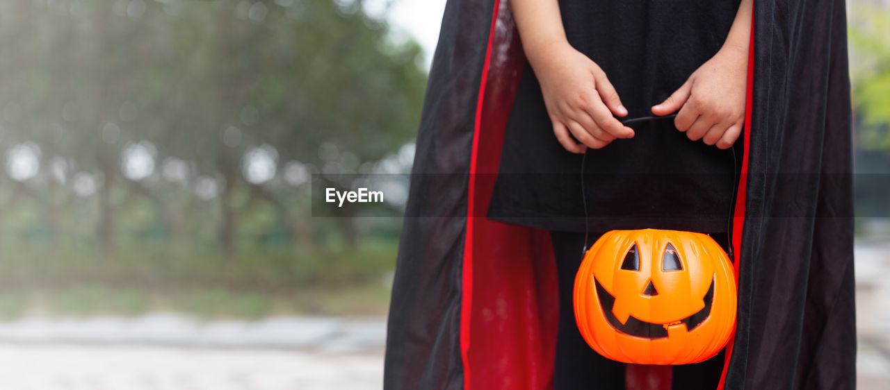 rear view of woman standing against wall