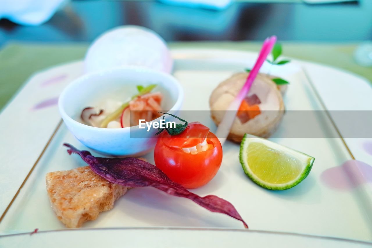 CLOSE-UP OF FRUITS SERVED ON PLATE