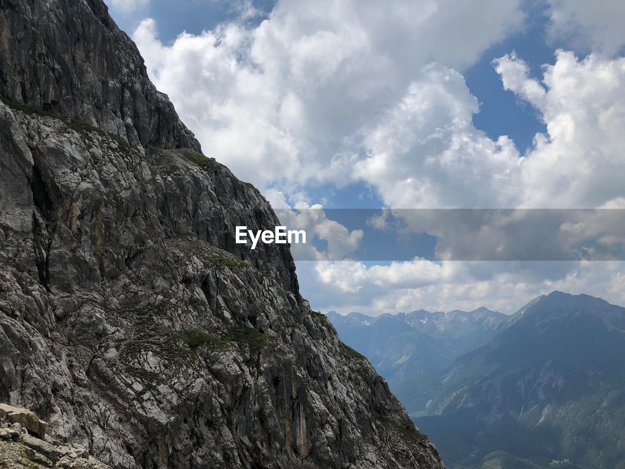 Low angle view of rocky mountains against sky