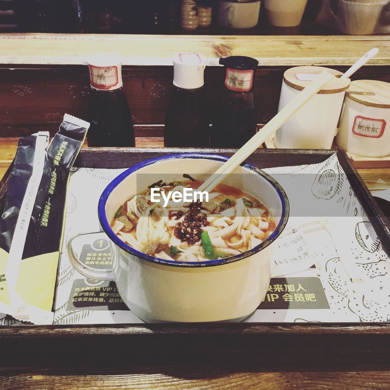 Food in container on tray over table