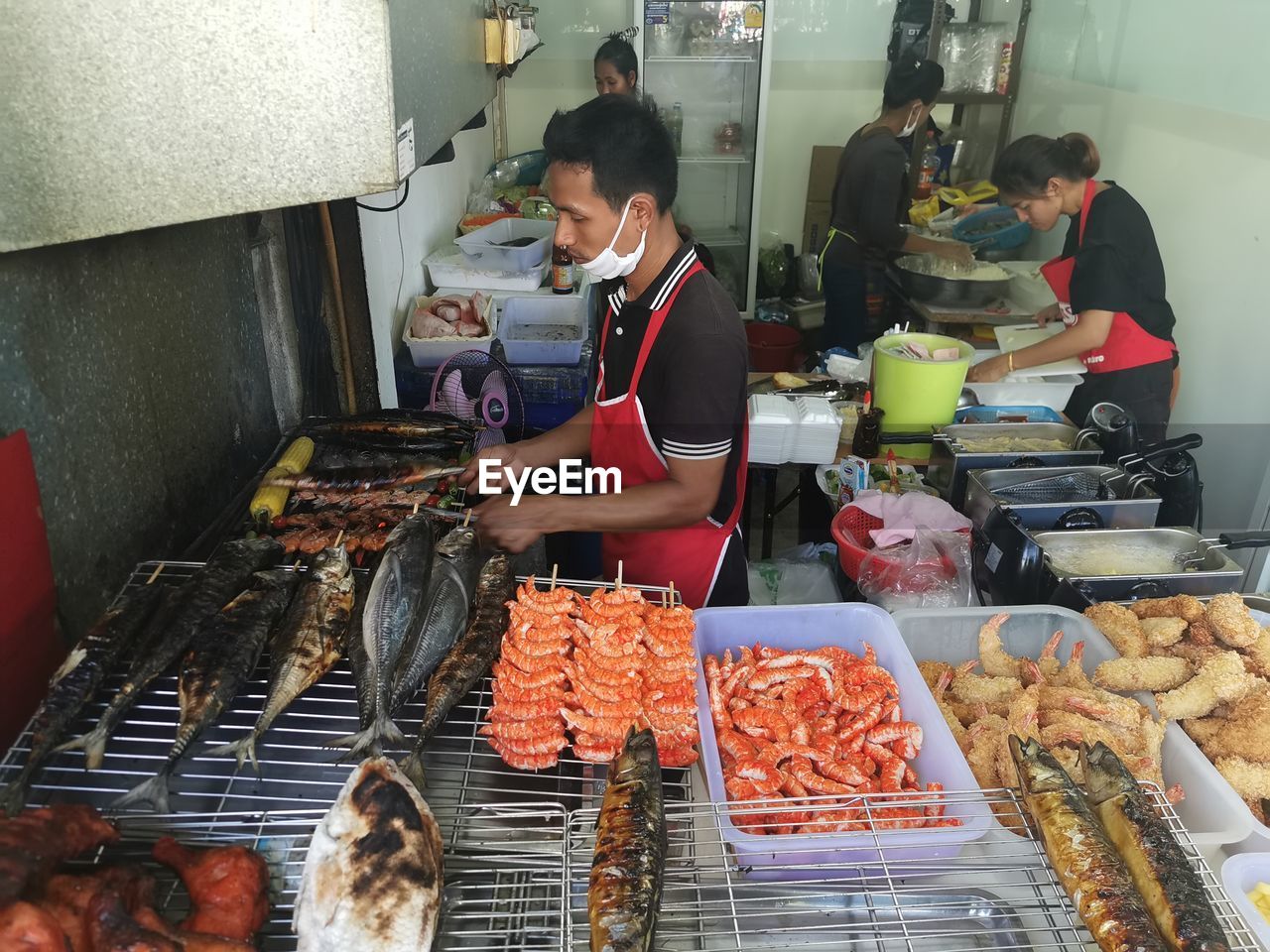 PEOPLE WORKING AT MARKET