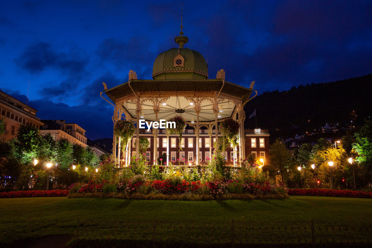 Illuminated building against sky at night