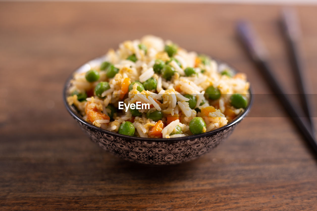 High angle view of cantonese rice in bowl on table