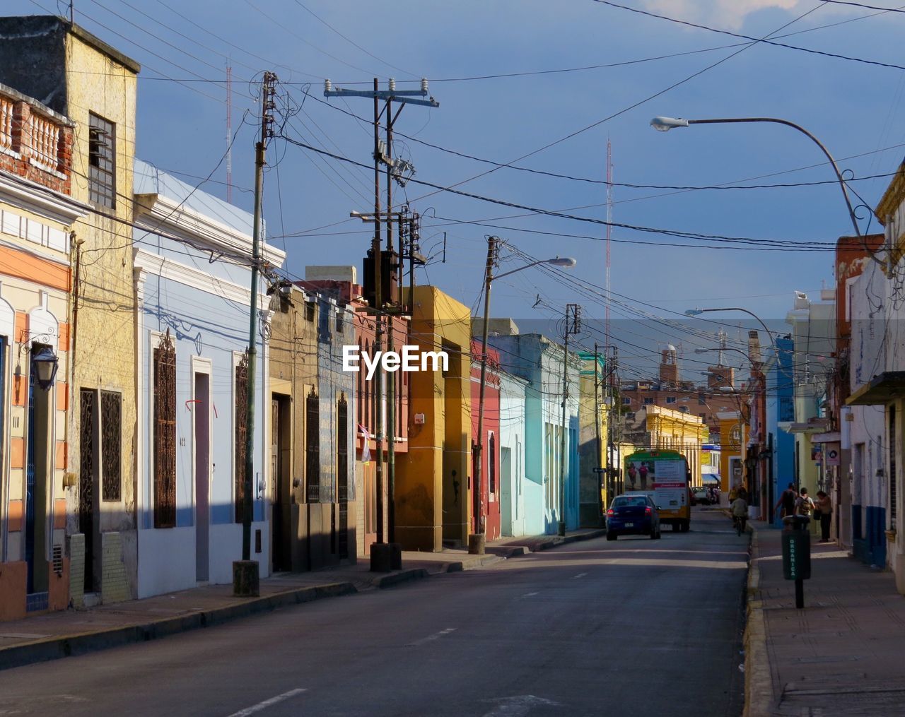 Vehicles on road along buildings