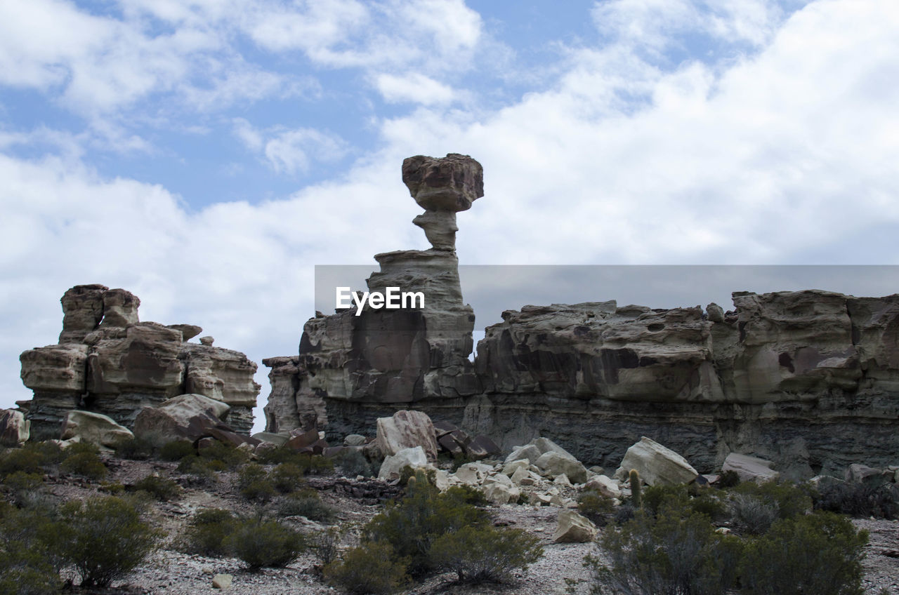 LOW ANGLE VIEW OF ROCK FORMATIONS AGAINST SKY