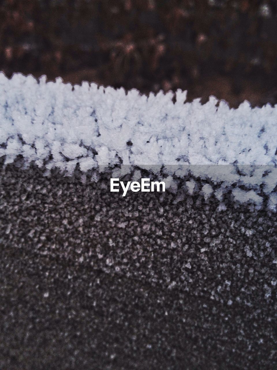 CLOSE-UP OF SNOW ON FIELD