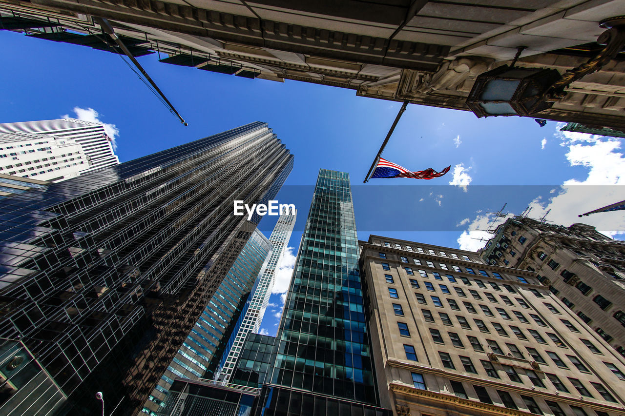 LOW ANGLE VIEW OF MODERN BUILDINGS AGAINST SKY