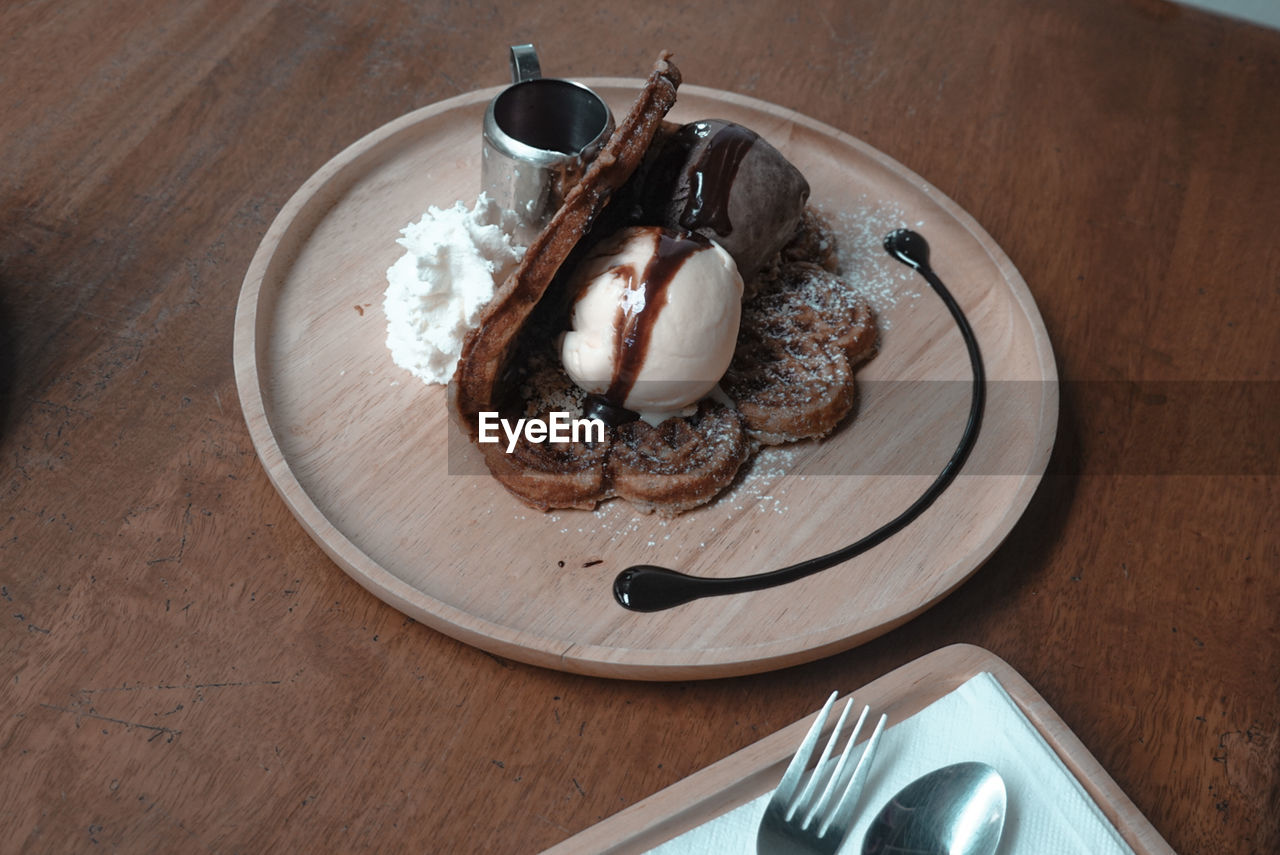 High angle view of ice cream in plate on table