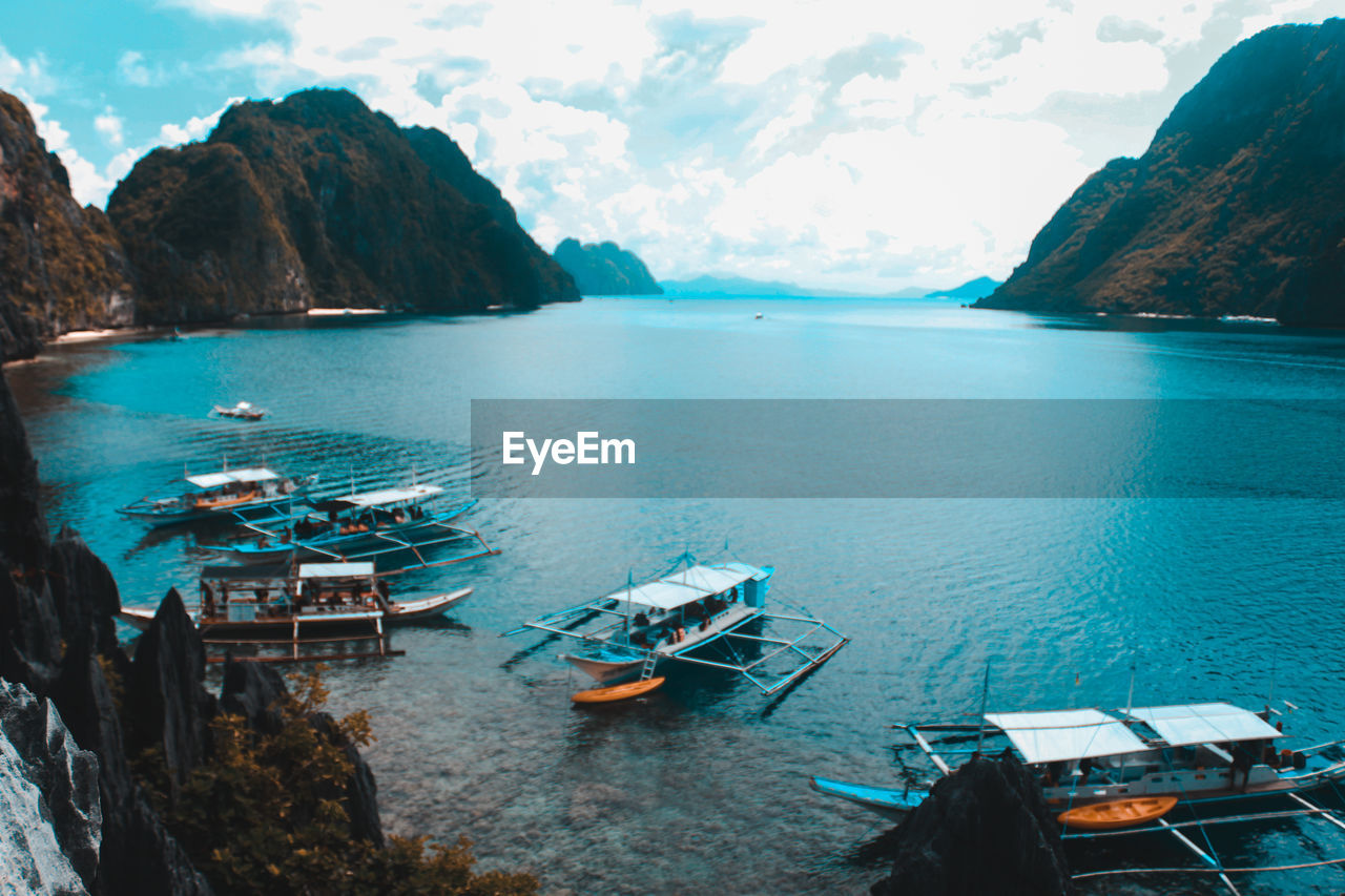 Panoramic view of boats moored in bay