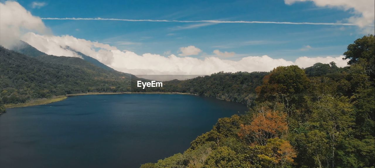 Scenic view of lake and mountains against sky