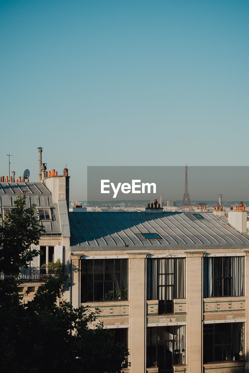 BUILDINGS AGAINST CLEAR SKY