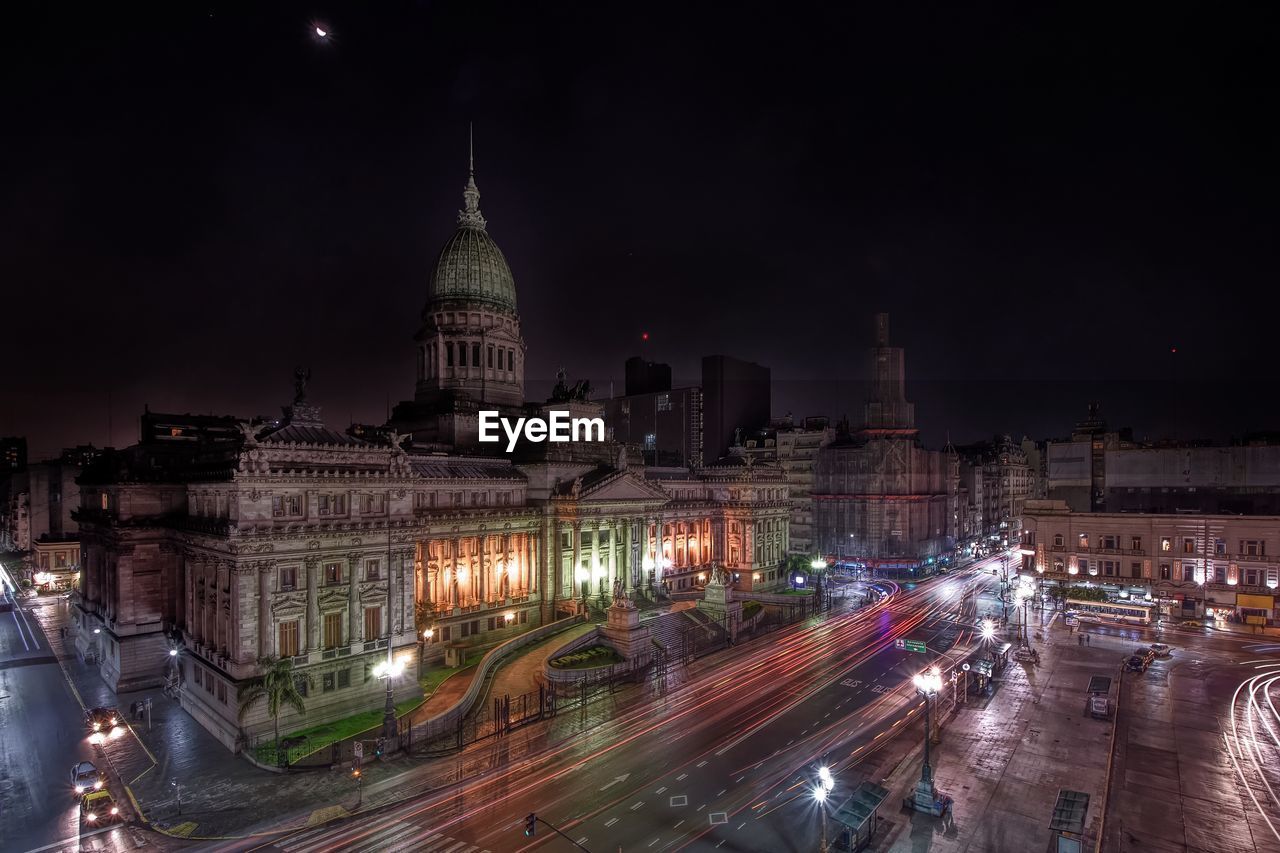 Light trails by national congress of argentina in city at night