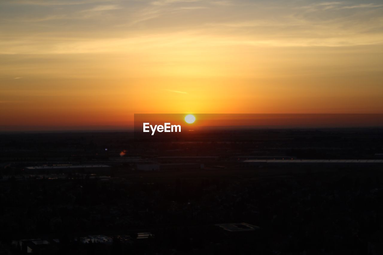 SCENIC VIEW OF SUNSET OVER LANDSCAPE