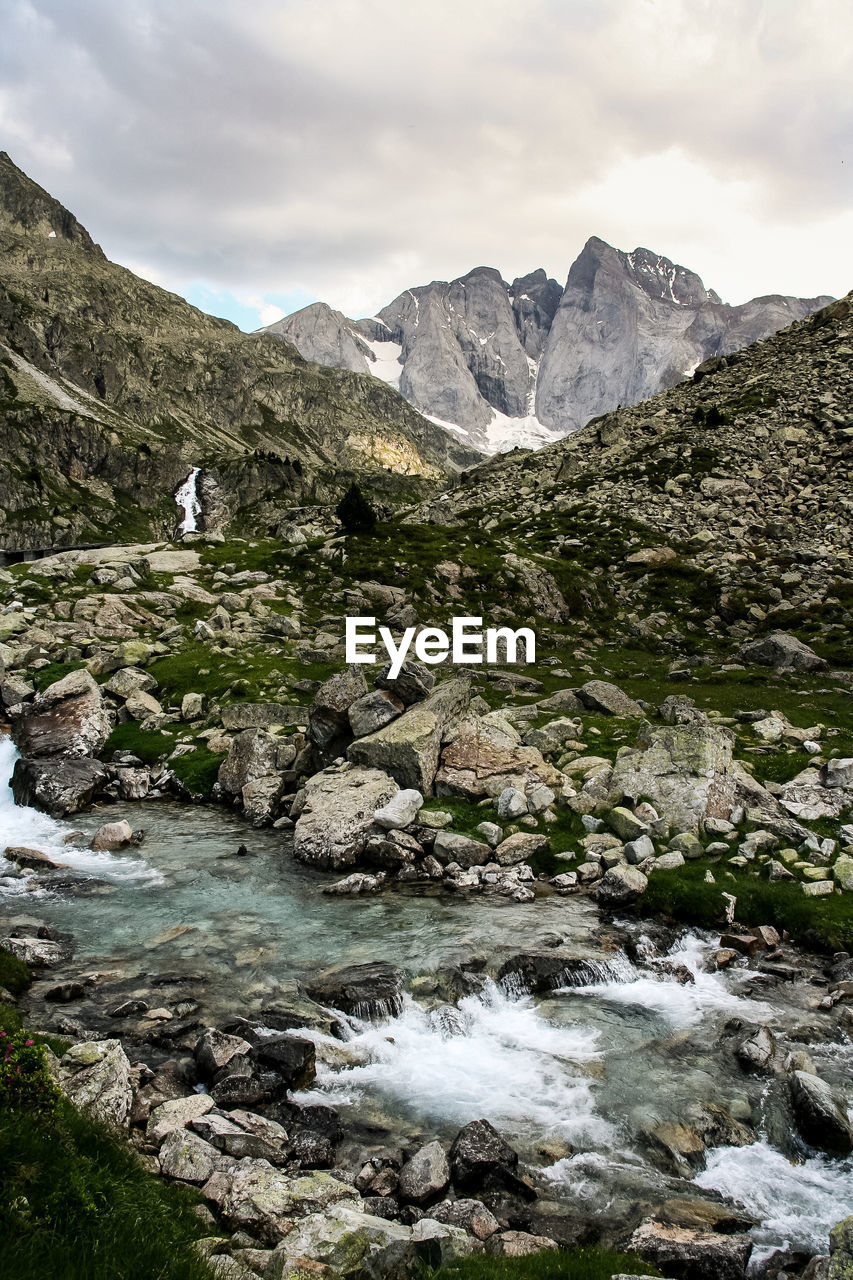 Stream amidst rocks at pyrenees