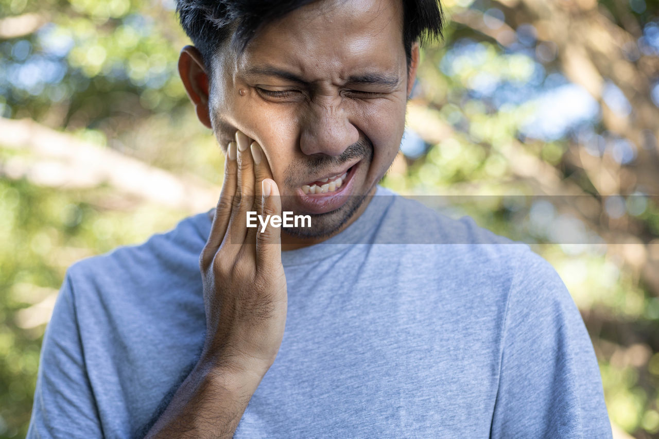 Close-up of man with toothache