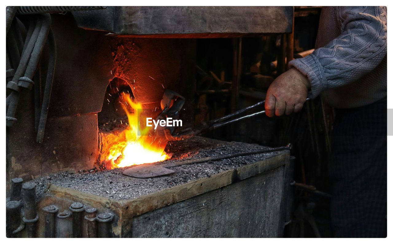 Cropped image of man preparing food