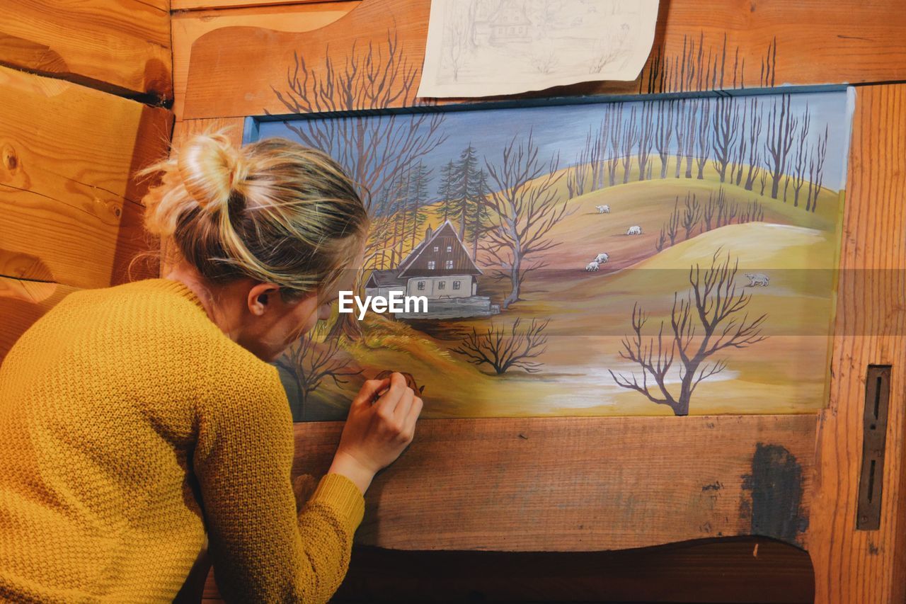 Young woman painting