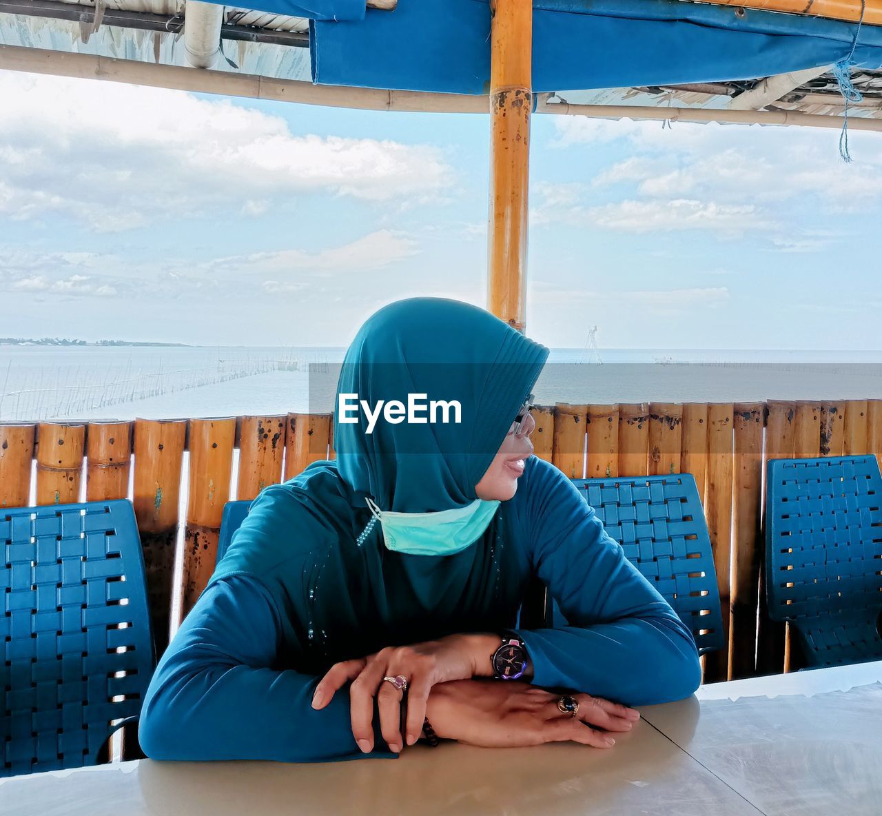 Woman sitting on chair at table