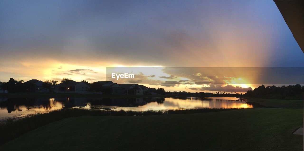 Scenic view of lake against sky during sunset