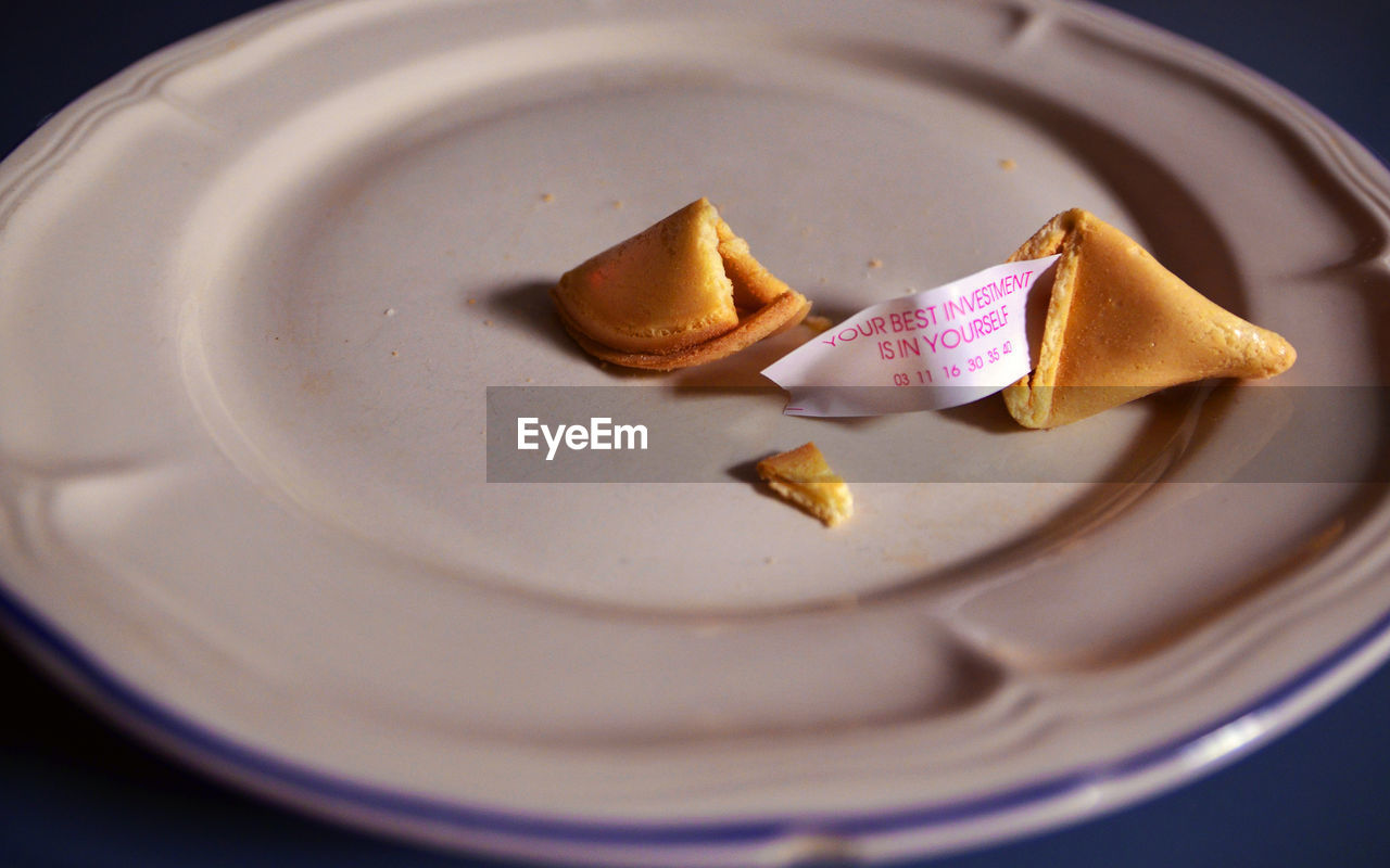 High angle view of fortune cookie on plate