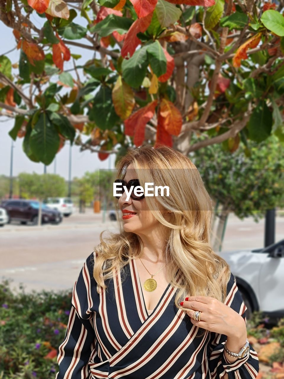 rear view of woman wearing hat against trees