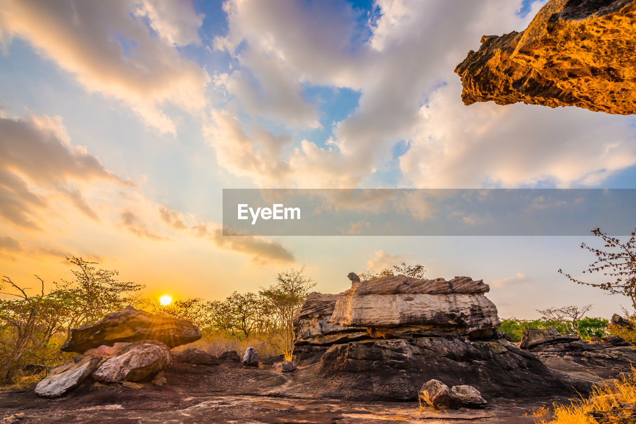 ROCK FORMATION ON LAND AGAINST SKY