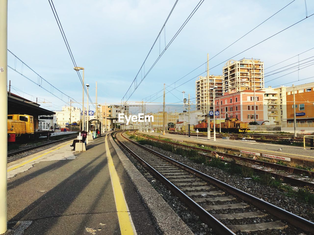 RAILROAD STATION PLATFORM AGAINST SKY