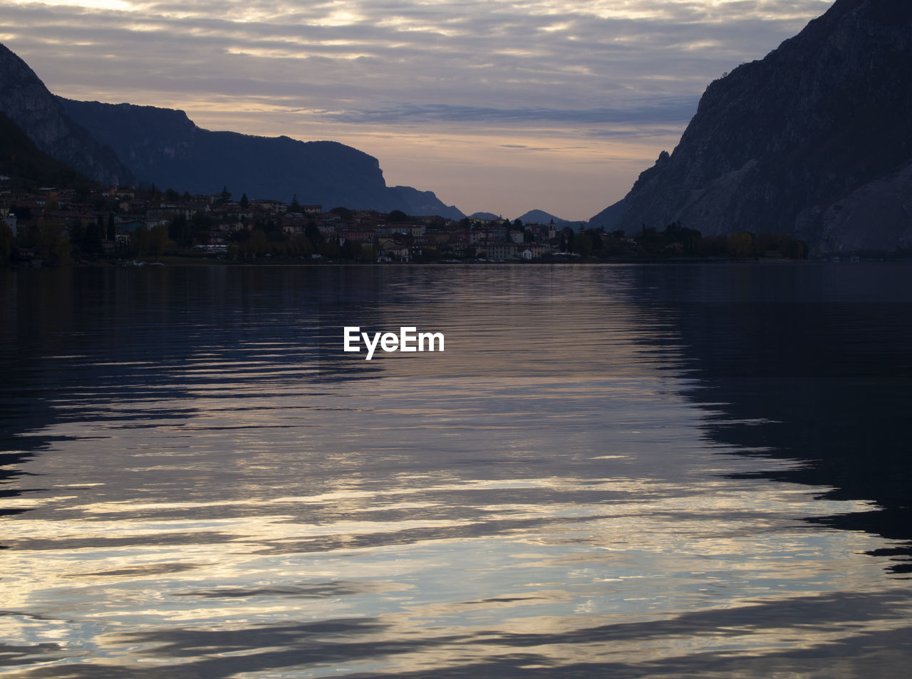 Scenic view of lake against sky during sunset