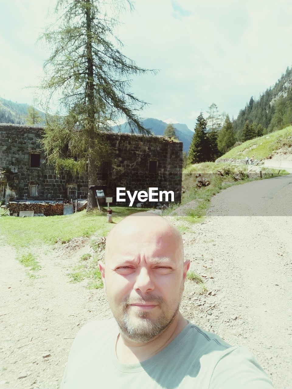 PORTRAIT OF MAN IN PARK