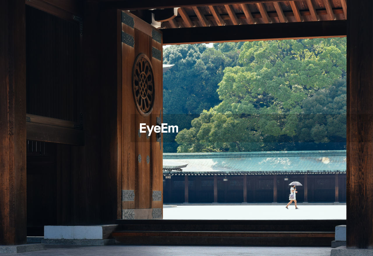 Woman seen through doorway