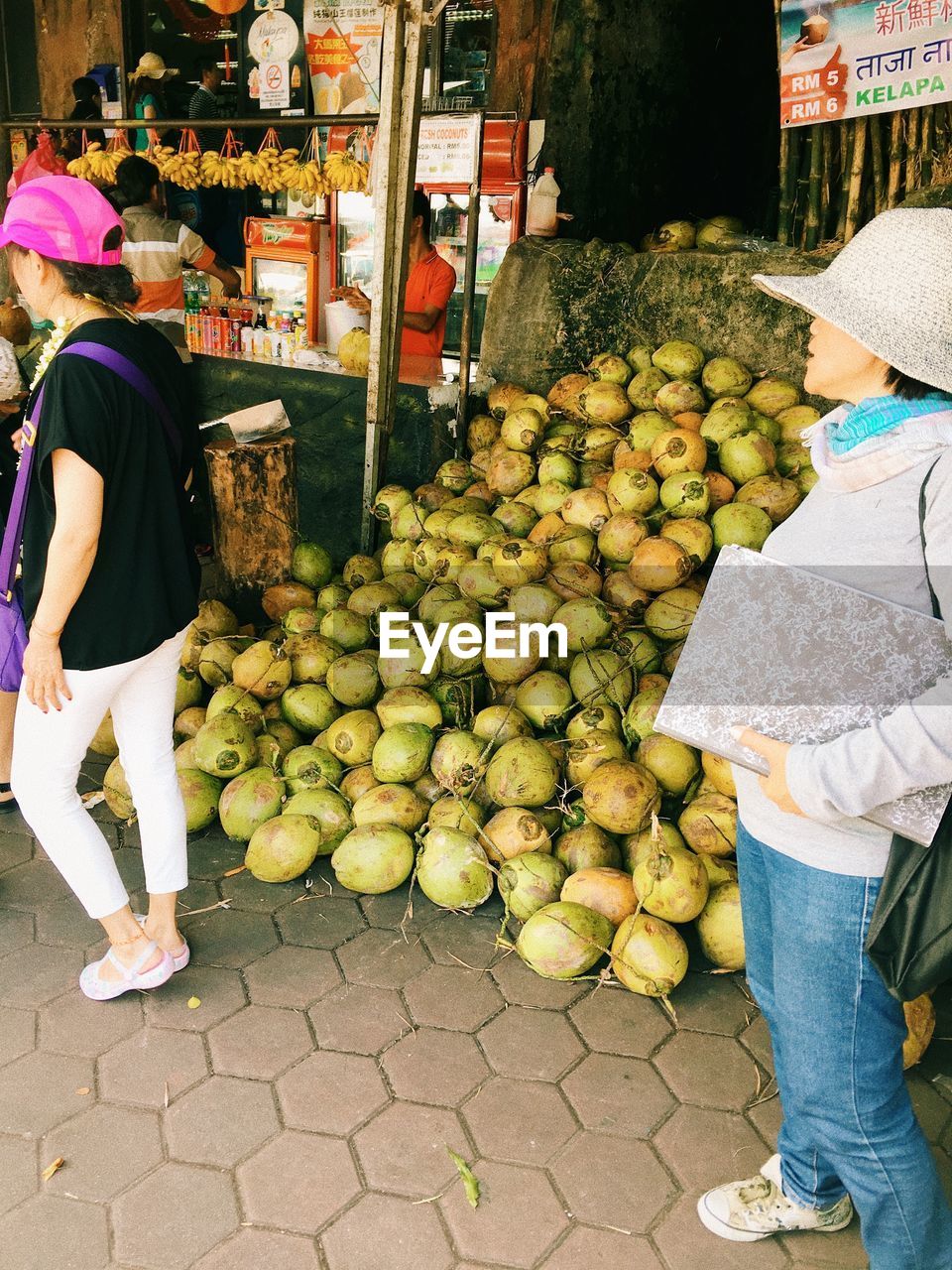 LOW SECTION OF PEOPLE AT MARKET