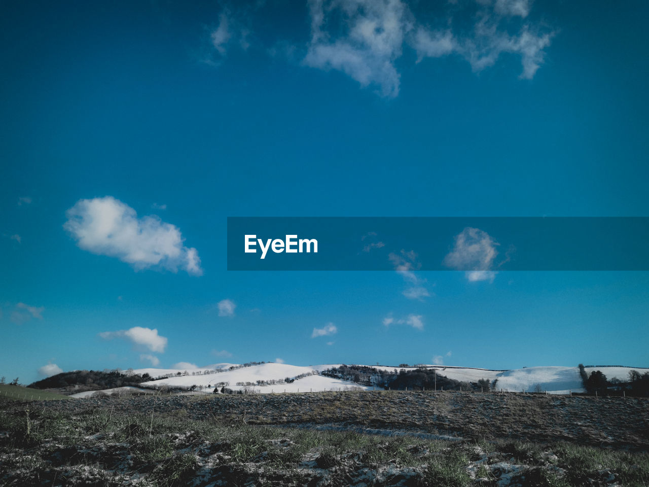 LANDSCAPE AGAINST BLUE SKY