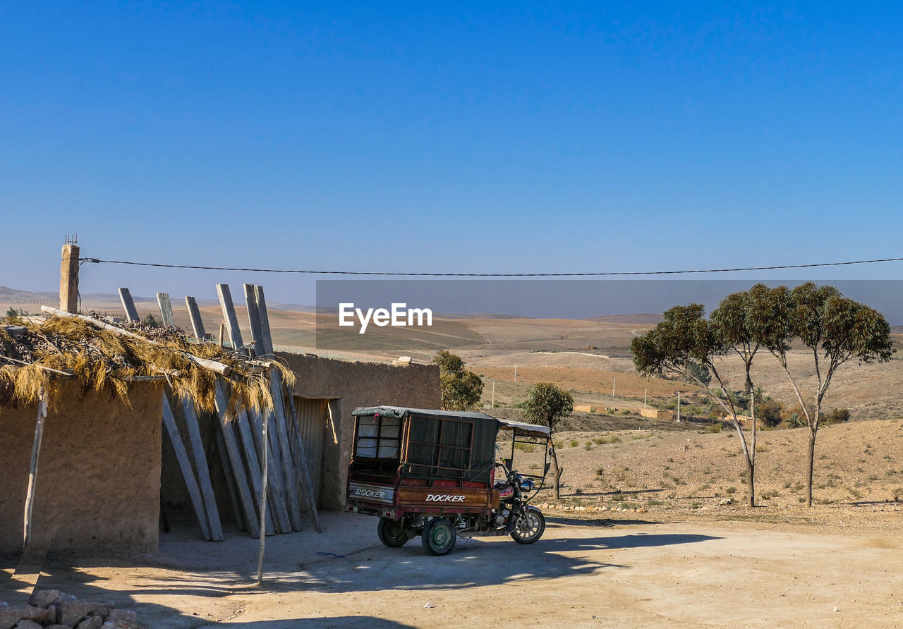 VIEW OF ROAD AGAINST CLEAR BLUE SKY