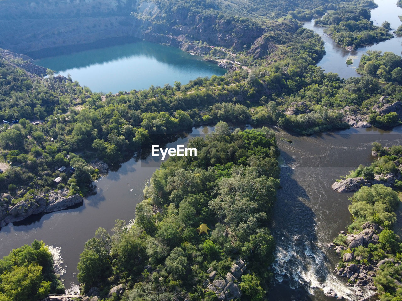 HIGH ANGLE VIEW OF RIVER IN FOREST