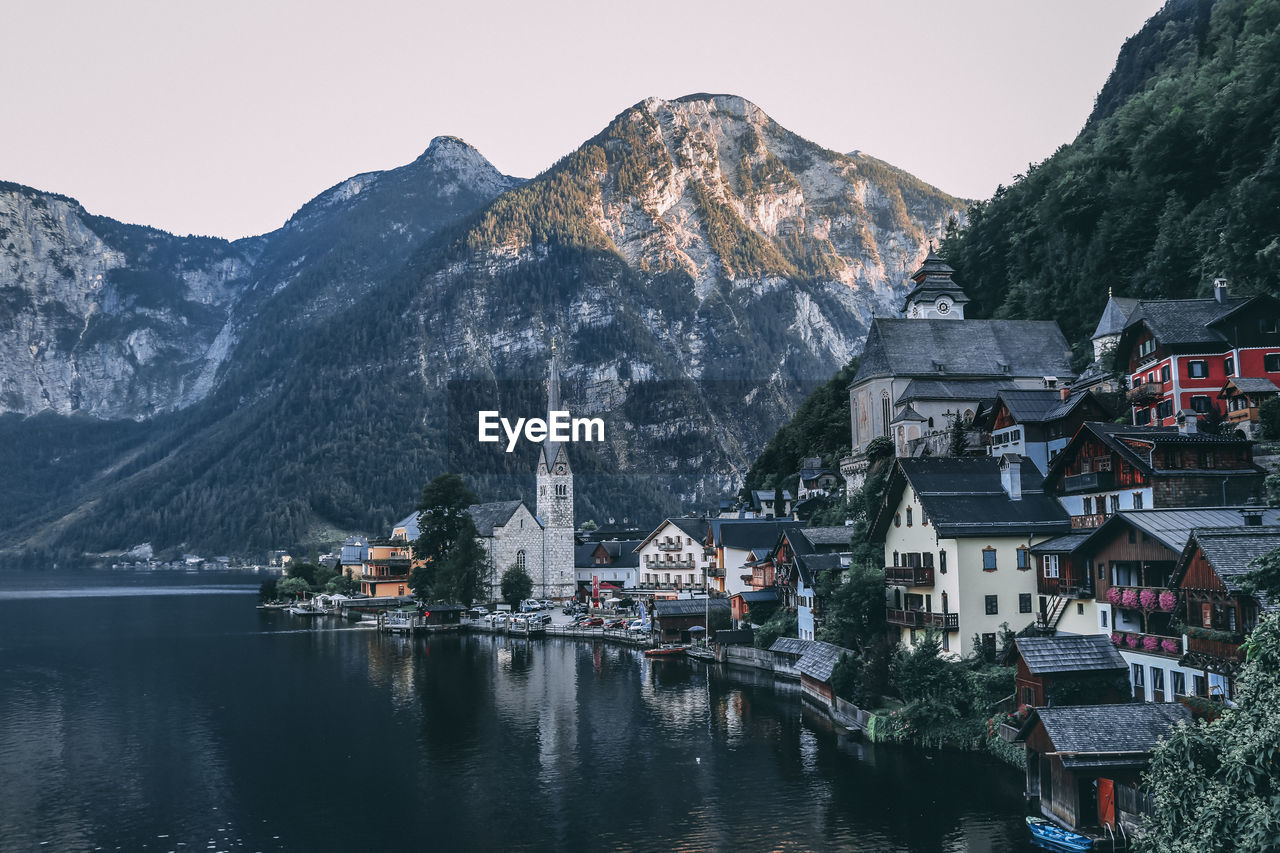 SCENIC VIEW OF LAKE AND BUILDINGS IN TOWN