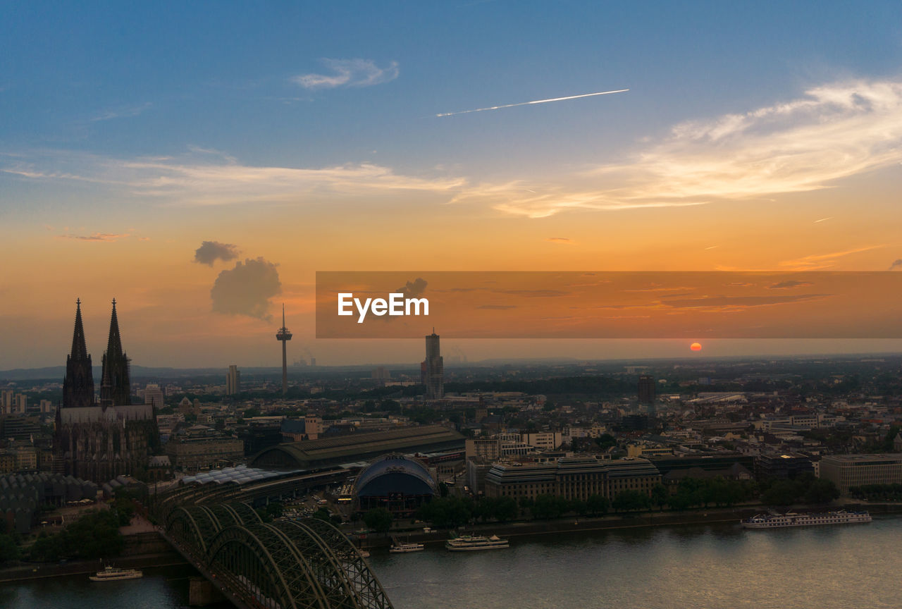 Aerial view of city at sunset