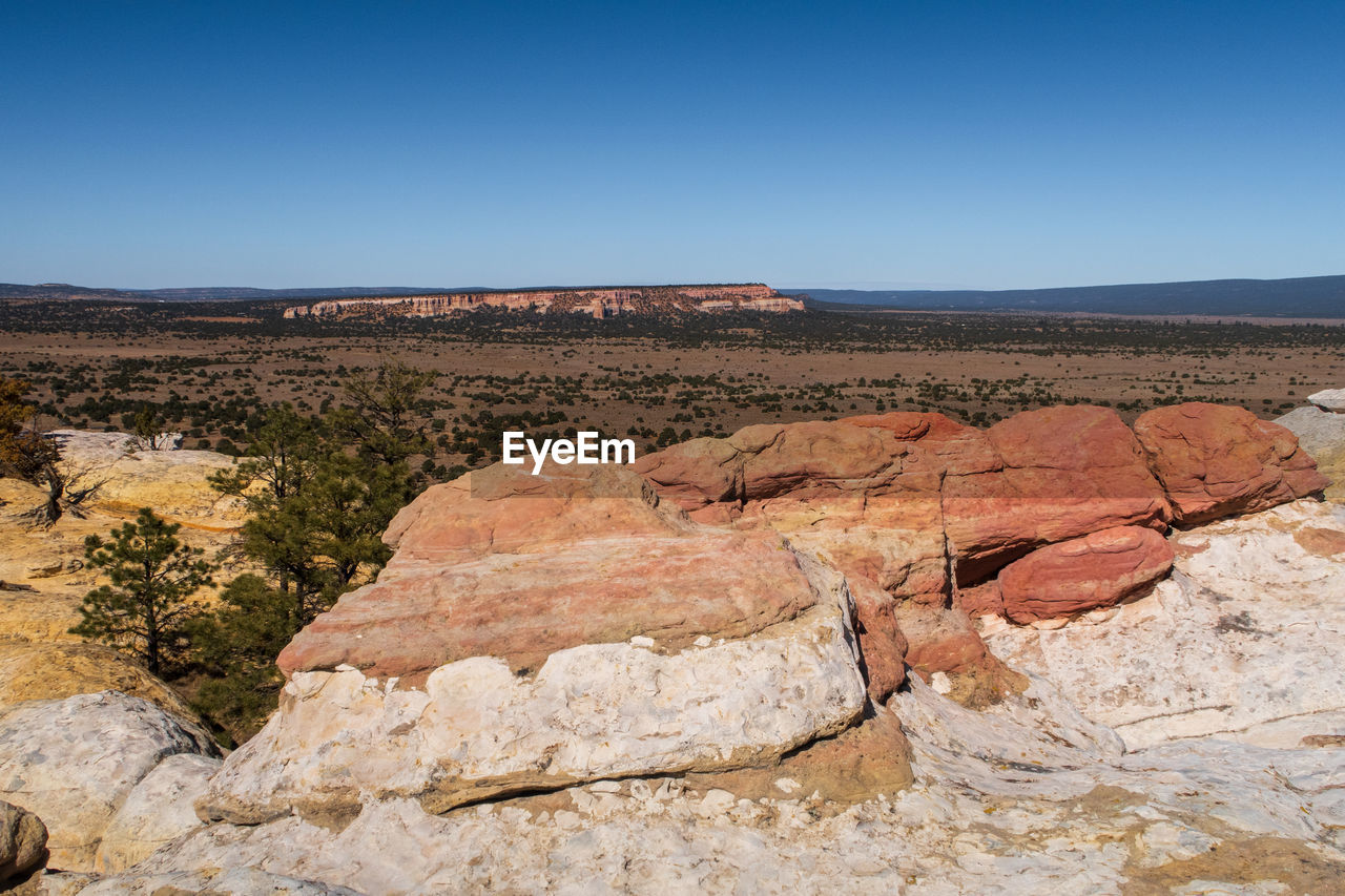 Landscape of large colorful rock formations atop el morro national monument in new mexico