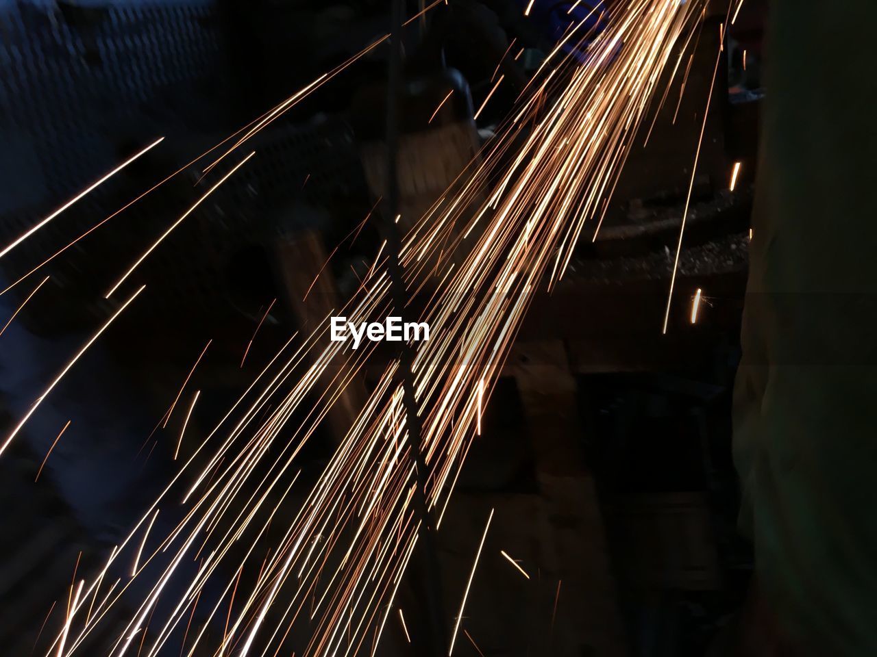 High angle view of sparks by worker