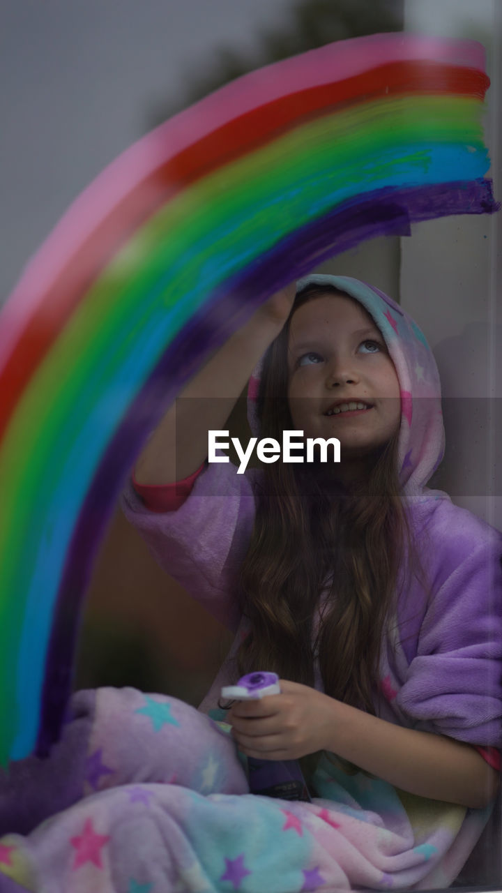 Portrait of smiling girl with multi colored hair